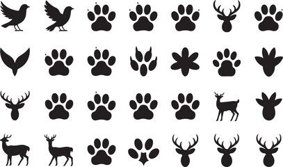 Fototapeta premium Collection of wildlife silhouettes featuring birds paw prints and deer antlers