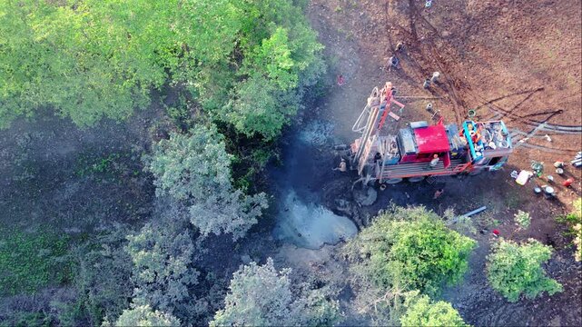 Aerial View of Borewell Drilling Site in Green Woodland