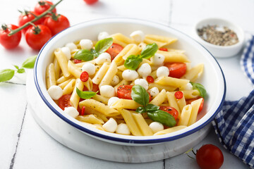 Pasta with mozzarella cheese and tomatoes