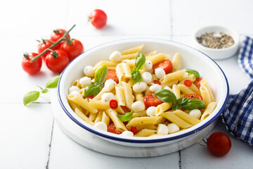 Pasta with mozzarella cheese and tomatoes