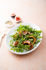 Arugula salad with smoked duck breast and fig