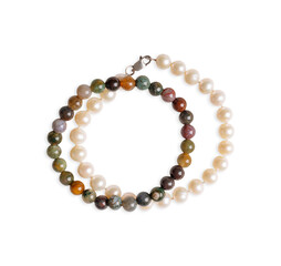 Top view of two beaded necklace or bracelets with pearls, greenstone and gemstones isolated on white background used as personal beauty accessory as fashion decoration detail or as romantic gift