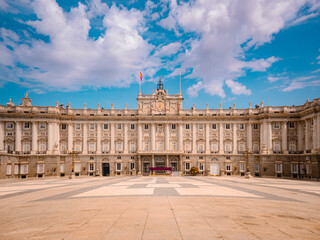 Stunning view of Palacio Real de Madrid under a vivid sky, highlighting its grand architecture and cultural heritage&mdash;an iconic destination for travel and exploration in Spain.