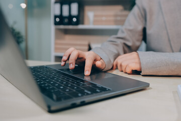 Entrepreneur Asian businessman and businesswoman discussing new business project in tablet in modern Meeting In Modern Office, Asian business casual concept.