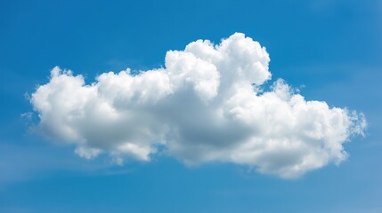 Fluffy cumulus cloud against a clear blue sky, creating a serene summer atmosphere.
