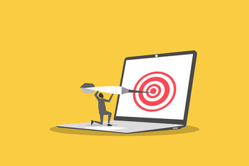 Businessman hitting Darts target on laptop display. concept of success, achieving goals and in the direction and development of a company, startup