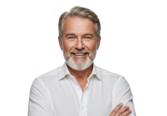 A handsome middleaged man with gray hair and a beard smiles with his arms crossed on
