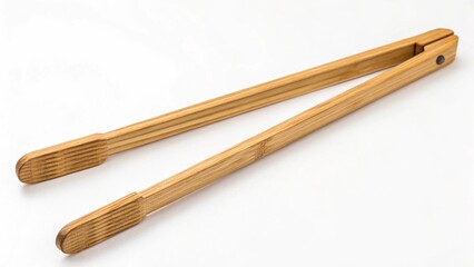 Simple wooden kitchen tongs on a white background for cooking and serving