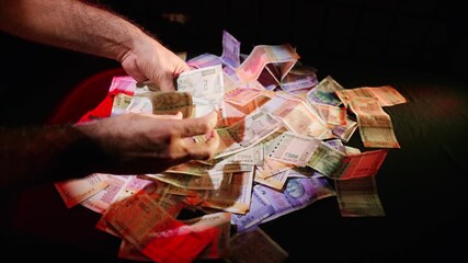 Hand Arranging 500 Notes with 200 and 100 Scattered