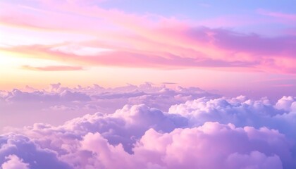 Pastel pink and purple clouds at sunrise or sunset, creating a serene, dreamy sky view.