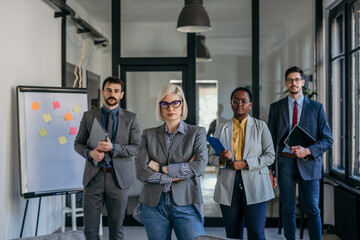 Serious business team posing in modern office environment