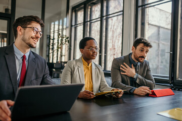 Managers having a conversation during a business meeting