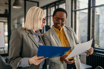 Businesswomen discussing documents in the office during a meeting