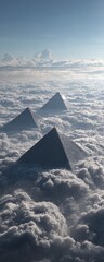 Three pyramids pierce a sea of clouds