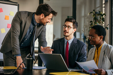 Business team discussing strategy during meeting in office
