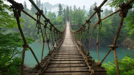 A rustic suspension bridge stretches across a tranquil valley.