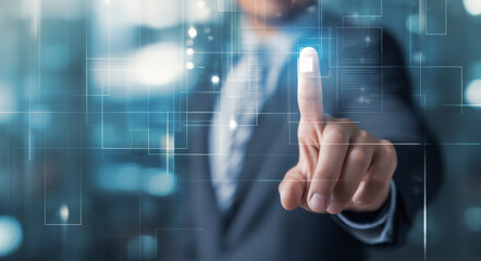 Businessman interacting with a digital interface, pressing a virtual button.