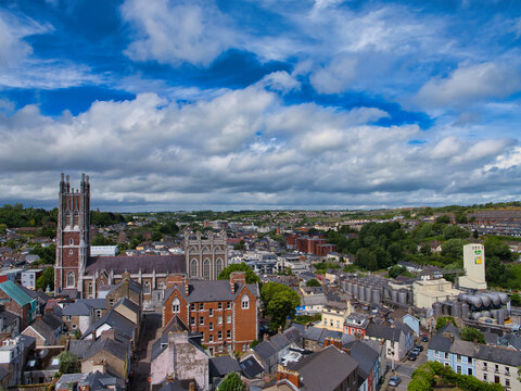 A breathtaking view of Cork's skyline captured from Shandon Tower, with historic architecture against a dramatic sky.