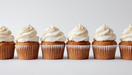 Row of delicious cupcakes with creamy frosting creates a sweet temptation against a bright background, perfect for celebrations and dessert lovers.