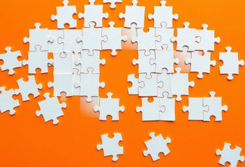 Intricate white puzzle pieces on vibrant orange backdrop,   jigsaw puzzle,  close up