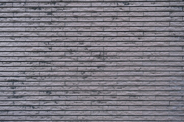 Brick wall with gray bricks