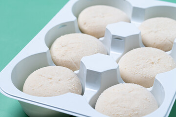Japanese Cheesecake ice cream mochi on green background. Close up