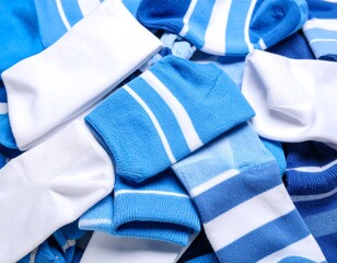 Pile of assorted blue and white striped socks