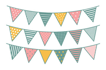 Three strings of colorful triangle shaped party flags with various patterns hanging on a white background