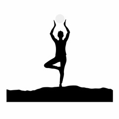 Fototapeta premium Morning Yoga in the Sun – Silhouette of a person in tree pose with rising sun behind