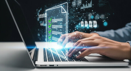 Person typing on a laptop with glowing data visualization overlay