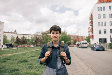 Young girl student walking in the city during morning routines