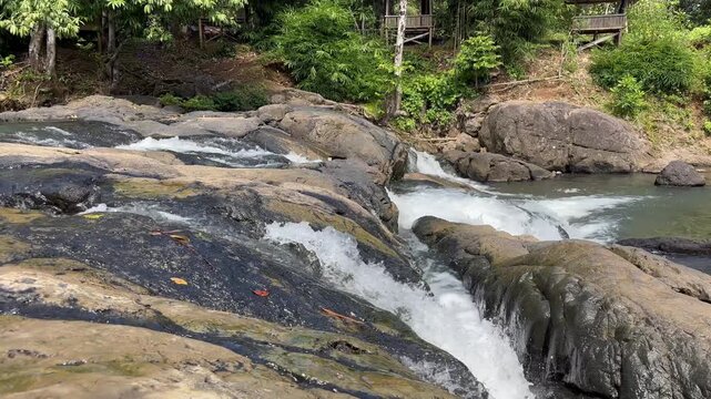 The beauty of the tourist attraction in the form of a waterfall in "Alam Roh 17" with very natural scenery located in South Kalimantan Province, Indonesia.