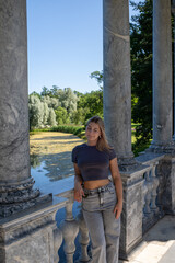 Fototapeta premium young woman standing near the wall