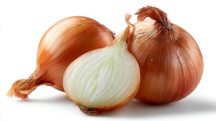 Close-up of fresh whole and halved onions with water droplets on white background.