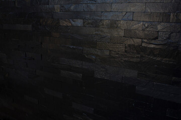 gloomy background, black brick wall of dark stone texture