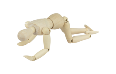 wooden man, wooden mannequin, crawling on all fours, isolated from background, concept of difficulties and pain