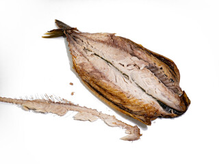 Smoked mackerel inside, with spines and bones next to it