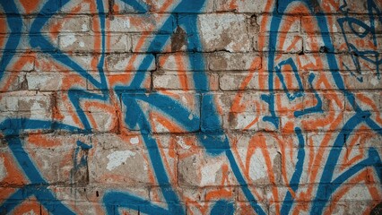 Brick Surface Adorned with Blue and Orange Paint Sprays