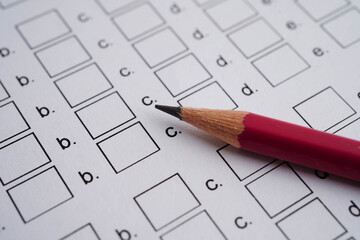 Answer sheets with pencil drawing fill to select choice, education concept.
