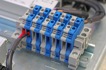 Electrical terminals with connected insulated copper wires with metal lugs. Marking with a thermal...