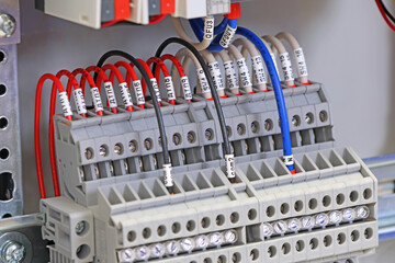 Electrical terminals with connected insulated copper wires with metal lugs. Marking with a thermal...