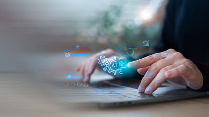 Close-up hand typing on laptop with AI interface graphics, representing artificial intelligence, machine learning, data analysis, and smart business technology.