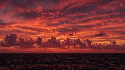 Fototapeta premium Vivid sunset casting colors over the ocean
