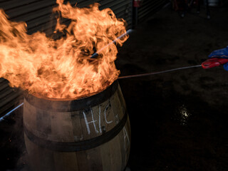 A whisky barrel being charred for storage