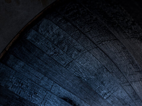 A whisky barrel being charred for storage