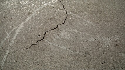 Detailed View of Aged Concrete with Pebbles Under Natural Lighting