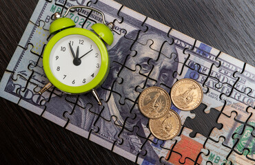 Puzzle Pieces of a $100 Bill, $1 Coin and Alarm Clock