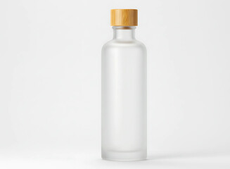 Clear glass bottle with golden cap filled with clear liquid