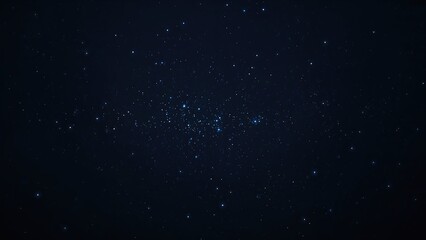 Fototapeta premium A group of stars shines at night, arranged in a compact linear formation