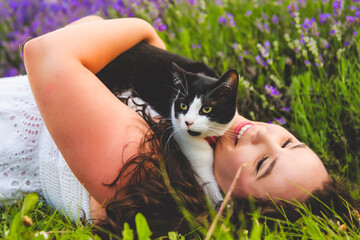 woman with cat friend on a lavender field